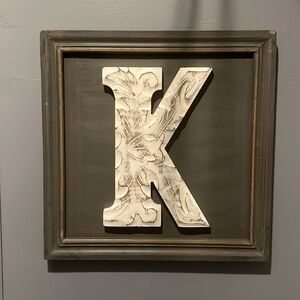 “K” wood hanging art
